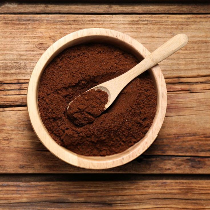 Beverage base powder measured out with a wooden scoop